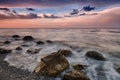 Amazing landscape of sunrise at sea. Colorful morning view of dramatic sky, seascape and rock. Greece.