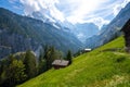 Amazing landscape of swiss Alps with green meadows and wooden huts in Murren Lauterbrunnen in Switzerland Royalty Free Stock Photo