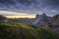 Amazing landscapes view of green mountain with gold sky on sunrise morning from Dolomites, Italy. Royalty Free Stock Photo