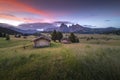 Amazing landscapes view of hut and hills with summer blue sky on sunrise from Seiser Alm Dolomites, Italy.