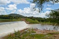 Amazing lanscape with small waterfall. African people are washing clothes near Kamuzu dam in Lilongwe, Malawi - in one of the