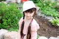 Amazing little girl in pink dress and white hat Royalty Free Stock Photo