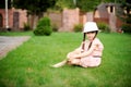 Amazing little girl in pink dress and white hat Royalty Free Stock Photo