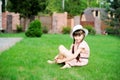 Amazing little girl in pink dress and white hat Royalty Free Stock Photo