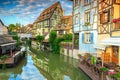 Amazing medieval half-timbered facades reflecting in water, Colmar, France Royalty Free Stock Photo