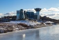 Amazing mirrored building on the banks of the frozen river on a Sunny day Royalty Free Stock Photo