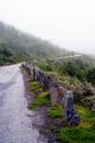 Road in the mountains captured during the fog. Mountainous landscape of Norway.