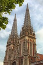 Amazing morning view of the Saint Nicholas Roman Catholic Cathedral House of Organ Music. Two gothic towers against cloudy sky. Royalty Free Stock Photo