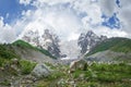 Amazing mountain Caucasus landscape of peaks of mountains Tetnuldi, Gistola and Dzhangi-Tau and glacier Lardaad in Svaneti Georgia Royalty Free Stock Photo
