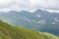 Amazing mountain landscape with colorful vivid sunlight on the cloudy sky, natural outdoor travel background Royalty Free Stock Photo