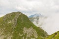 Amazing mountain landscape with colorful vivid sunlight on the cloudy sky, natural outdoor travel background Royalty Free Stock Photo