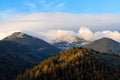 Amazing mountain landscape with colorful vivid sunrise with snow in top