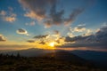 Amazing mountain landscape with colorful vivid sunset on the cloudy sky, natural outdoor travel background Royalty Free Stock Photo