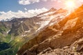 Amazing mountain landscape with colorful vivid sunset on cloudy sky, natural outdoor travel background. Mountains landscape. snow- Royalty Free Stock Photo