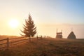 Amazing mountain landscape with fog and a haystack in autumn Royalty Free Stock Photo