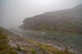 Amazing mountain river in Norway foggy morning Turquoise River. Fast flow mountain River in Norway Royalty Free Stock Photo