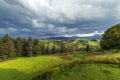 Amazing mountain view. wooden fence, rural road and high mountain village on sunset. summer landscape. beautiful natural Royalty Free Stock Photo