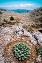 Amazing mountainscape plateau with motion clouds scenery on the horizon. Rocky highland in Greece with barren vegetation