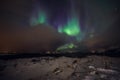 Amazing multicolored Aurora Borealis also know as Northern Lights in the night sky over Lofoten landscape, Norway, Scandinavia. Royalty Free Stock Photo