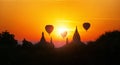 Amazing Myanmar sunset panorama with temples and air balloons Royalty Free Stock Photo