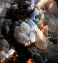 Amazing natural light reflections on healing Smokey Quartz wild jewels. Texture of gemstone with rainbow effect.