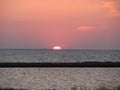 Amazing natural pictures of the sunset over the water mirror of the salt lake Sivash. Royalty Free Stock Photo
