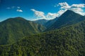 Amazing nature. An impressive green forest between the mountains landscape.