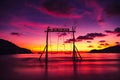 Scenic swings in the sea for a couple of lovers in love with a beautiful sunset