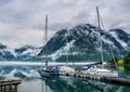 Amazing nature landscape view of lake surrounded by foggy mountains. Sailing vessels or ships. Nature lake. Forest natural. Royalty Free Stock Photo