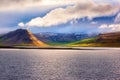 Amazing nature, scenic day time landscape with water, volcanic mountains and cloudy sky, Iceland. Travel outdoor