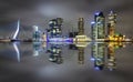 Amazing night reflection of Erasmus bridge and several skyscrapers in Rotterdam, Holland.