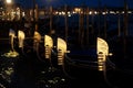 Amazing night urban landscape from venice city canal with gondolas anchored on grand canal in venice Royalty Free Stock Photo