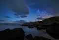 Night sky over a rocky coastline Royalty Free Stock Photo