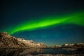 Amazing northern lights, aurora borealis over the mountains in the North of Europe - Lofoten islands, Norway Royalty Free Stock Photo