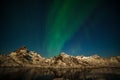 Amazing northern lights, Aurora borealis over the mountains in the North of Europe - Lofoten islands, Norway Royalty Free Stock Photo