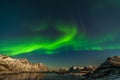 Amazing northern lights, Aurora borealis over the mountains in the North of Europe - Lofoten islands, Norway Royalty Free Stock Photo