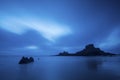 Amazing ocean landscape. night time and water lige clouds and fog. rocks in the middle of the sea. long exposure with clouds in Royalty Free Stock Photo