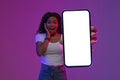 Amazing Offer. Surprised Black Woman Showing Blank Smartphone With White Screen Royalty Free Stock Photo