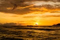 Amazing orange and cloudy sunset in a tropical island, Anse Severe beach, La Digue, Seychelles Royalty Free Stock Photo