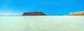 Amazing panorama of Balos Lagoon with magical turquoise waters, lagoons, tropical beaches of pure white sand and Gramvousa island Royalty Free Stock Photo