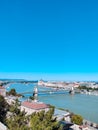 Amazing panorama of the city of Budapest on a sunny day. Bridge, river and small buildings. Vertical photo. Budapest, Hungary Royalty Free Stock Photo