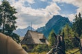 Amazing panorama of the forest and mountains, old house and horse on behalf of the cartman Royalty Free Stock Photo