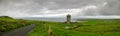Amazing Panorama Of Ocean Bay With Gothic Lighthouse Tower, Green Grass And Scenery Road Near Galway, County Clare, Ireland