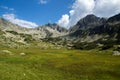 Amazing panorama of The Tooth and Yalovarnika peaks in Pirin Mountain Royalty Free Stock Photo