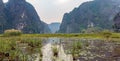 Amazing panorama view of the rice fields, limestone rocks and mountaintop Pagoda from Hang Mua Temple viewpoint.