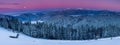 Amazing panorama of winter morning in the mountains. View of the moon and the snow-capped peaks.