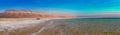 Amazing panoramic Dead Sea with blue and teal colors in the middle of the day Royalty Free Stock Photo