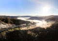 Amazing panoramic landscape of Carpathian Mountains, magical beauty of ukrainian autumn mountains and forests. Morning fog spreads