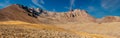 Amazing panoramic landscape of Mount Erciyes. View of the an inactive volcano: mountain range, stony slopes, rocky peaks formed by Royalty Free Stock Photo