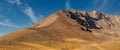 Amazing panoramic landscape of Mount Erciyes. View of the an inactive volcano: mountain range, stony slopes, rocky peaks formed by Royalty Free Stock Photo